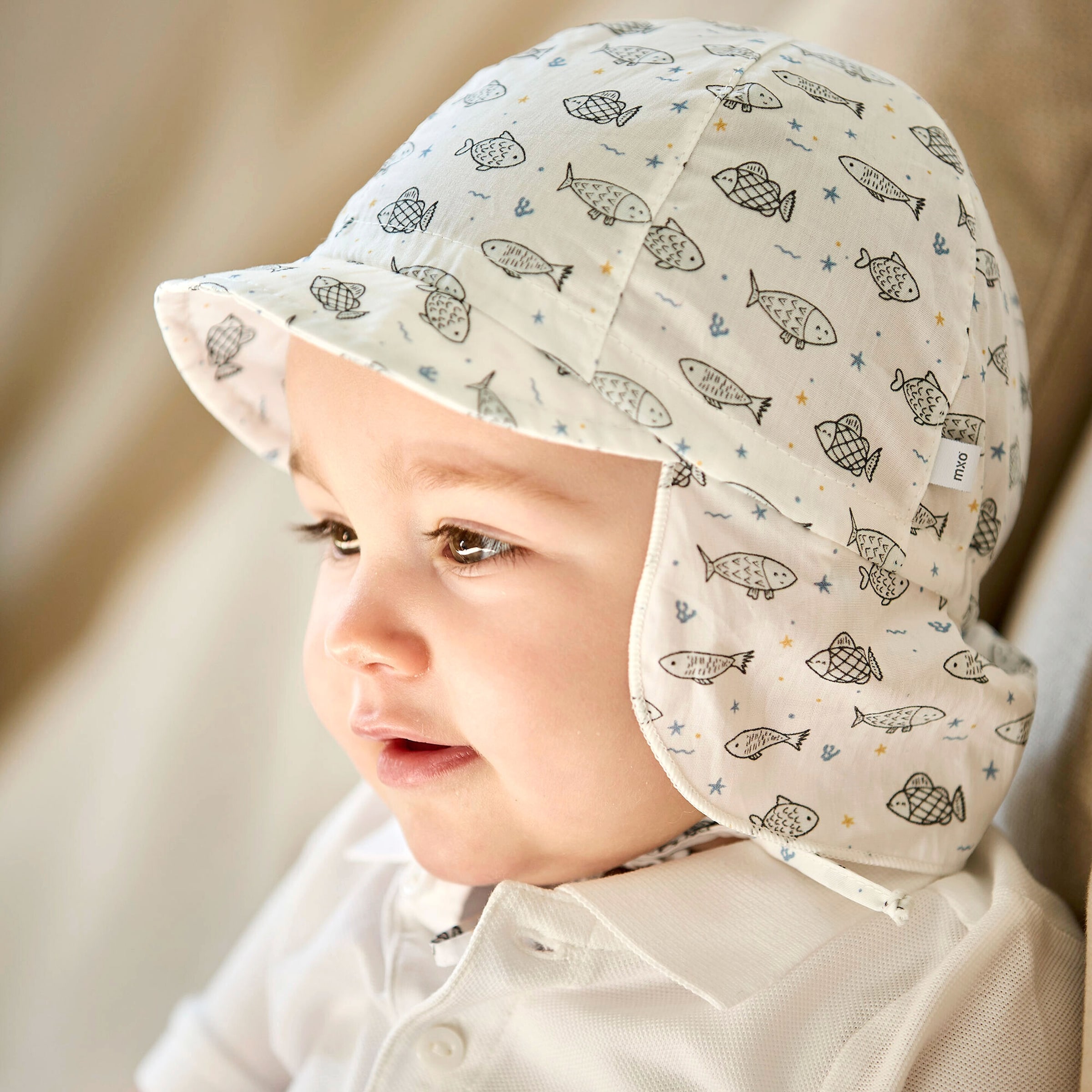 Schirmmütze mit Nacken- und UV-Schutz Fische