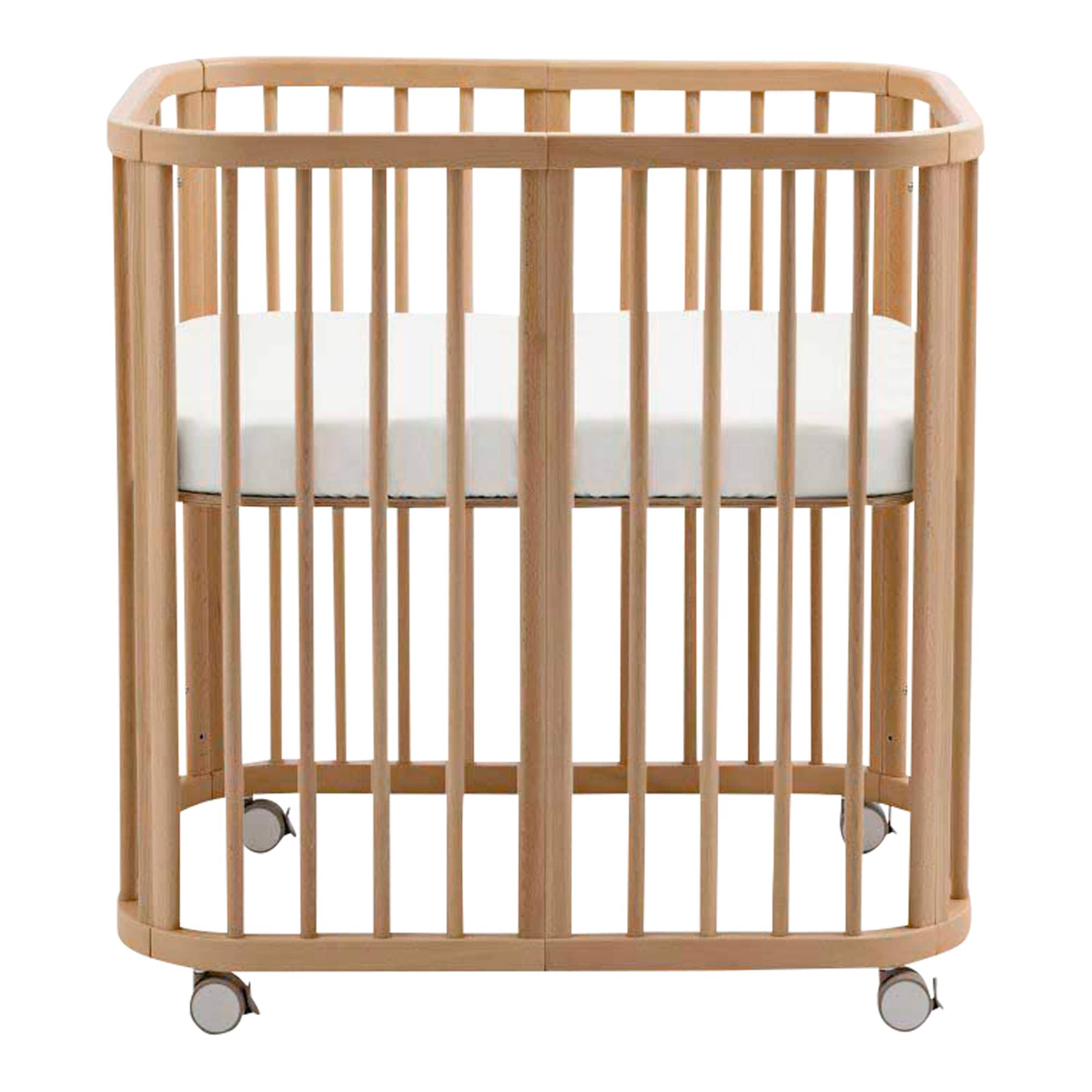 Stokke® Nighti™ Bundle Nighti Mini inkl. Matratze, Spannbetttuch und Rollen